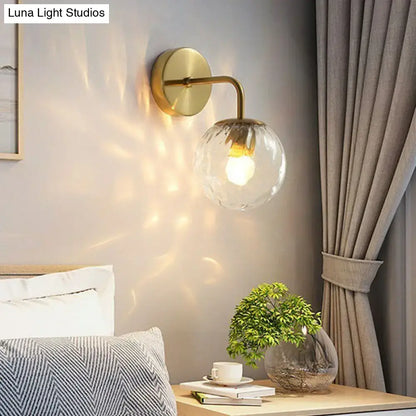 Black Metal Rippled Sconce with clear glass globe, brass finish by Decorbites on Tampa Home & Garden Store