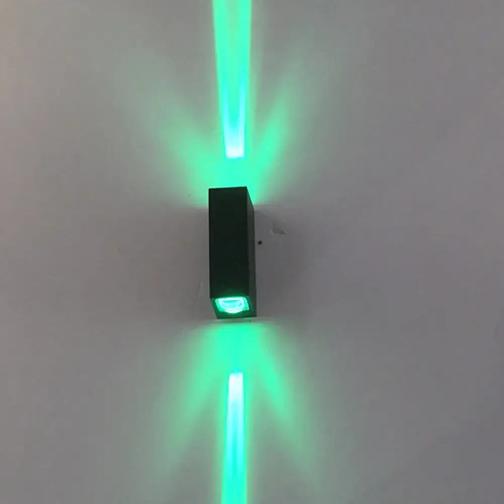 Black metal outdoor wall lamp with green LED uplight and downlight on Tampa Home & Garden Store