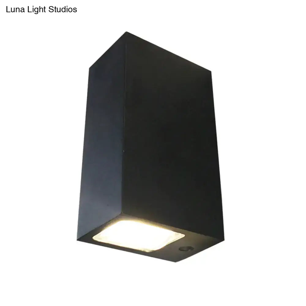 Black metal outdoor wall lamp with rectangular tapered lantern, warm LED light, Decorbites on Tampa Home & Garden Store