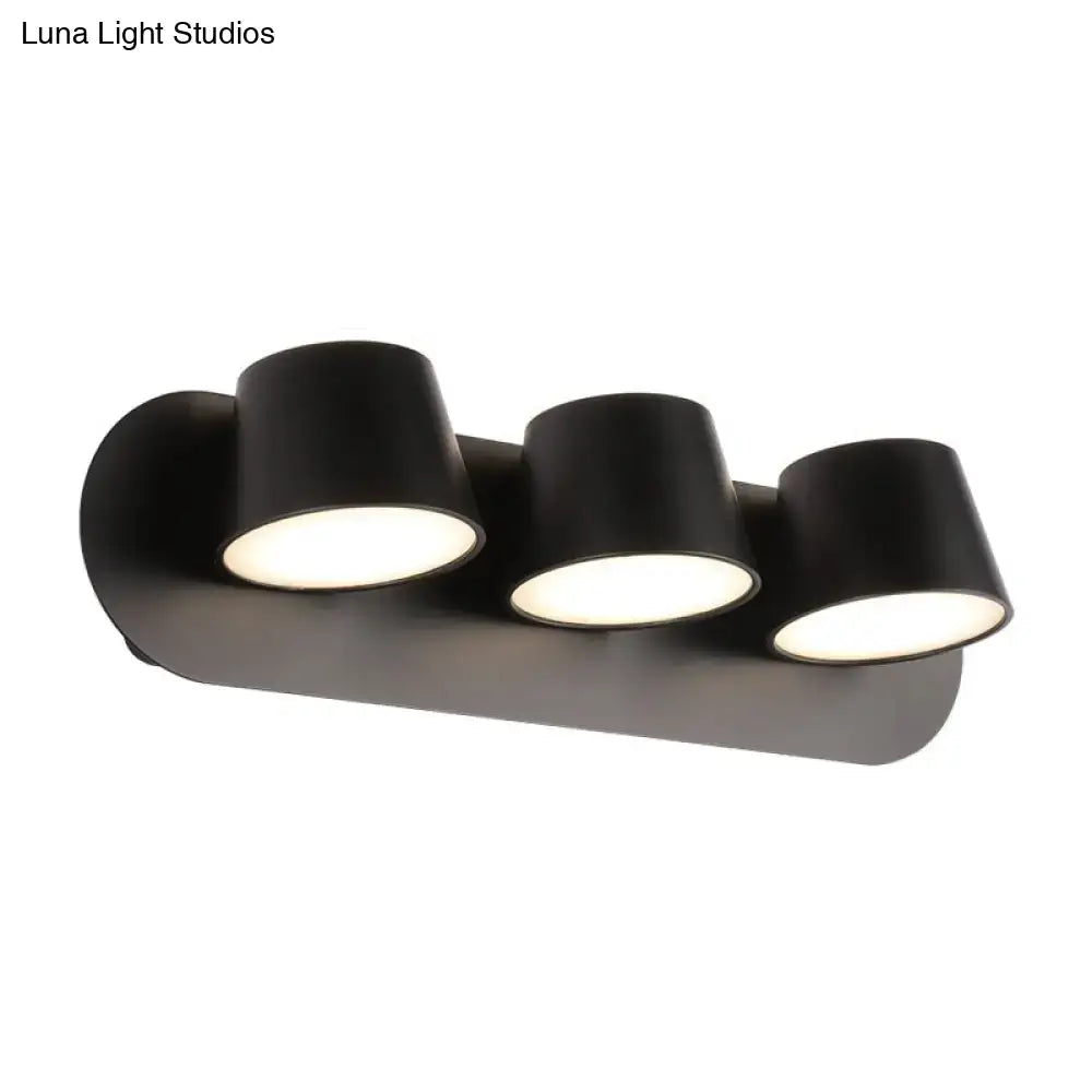 Black metal cone-shade sconce with three lights on Tampa Home & Garden Store