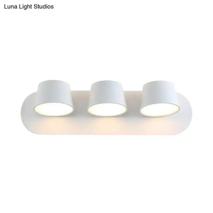 White metal cone-shade three-light sconce on rounded backplate Decorbites Home & Garden on Tampa Home & Garden Store