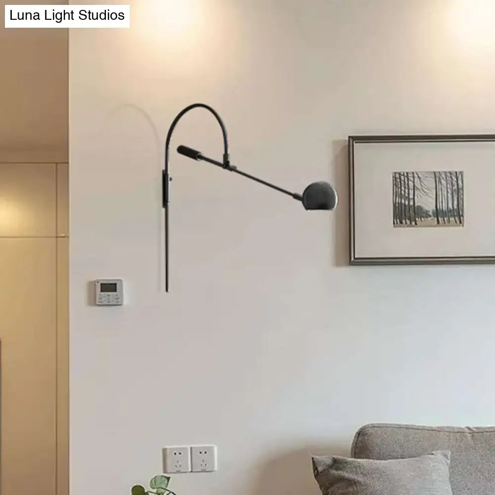 Black metal sphere sconce with adjustable arm, wall-mounted for modern living spaces on Tampa Home & Garden Store
