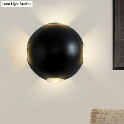 Decorbites black spherical outdoor wall sconce with ambient upward and downward glow on Tampa Home & Garden Store