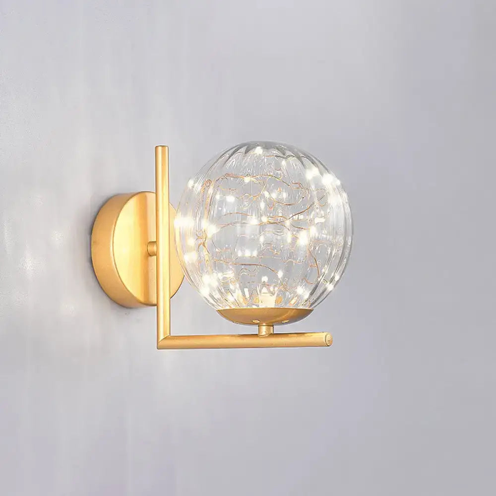 Black Globe Wall Sconce by Decorbites with clear glass orb and brass finish on Tampa Home & Garden Store