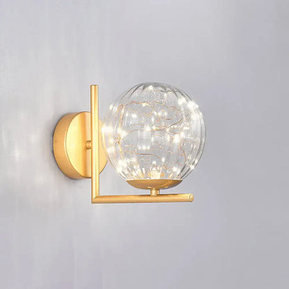 Black Globe Wall Sconce by Decorbites with clear glass orb and brass finish on Tampa Home & Garden Store