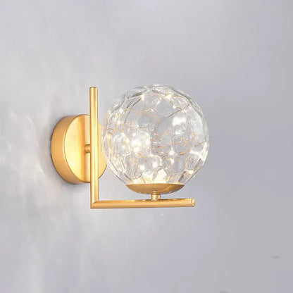 Black Globe Wall Sconce with brass finish and crackled glass globe on Tampa Home & Garden Store
