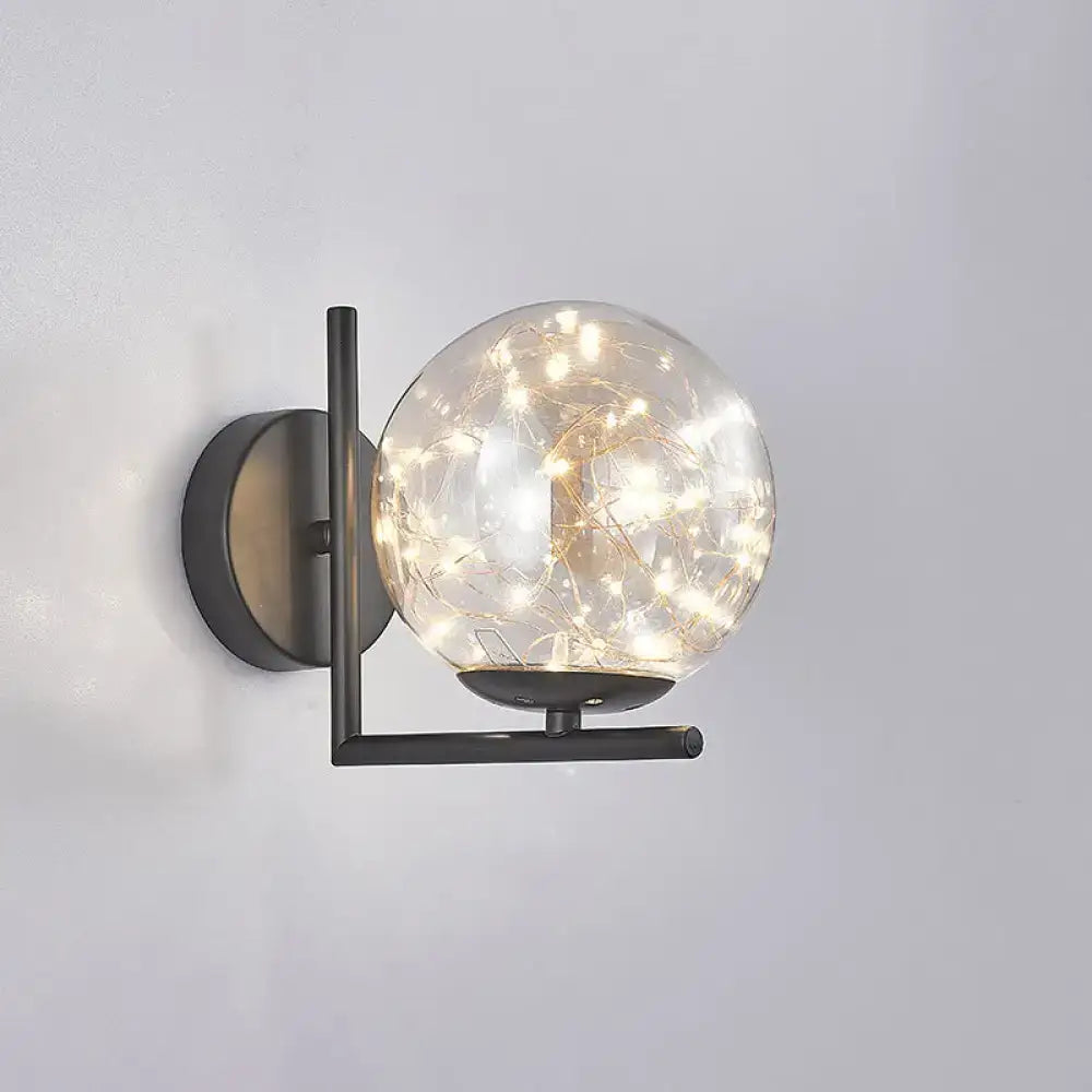 Black globe wall sconce with clear glass orb of string lights, black metal mount Decorbites on Tampa Home & Garden Store
