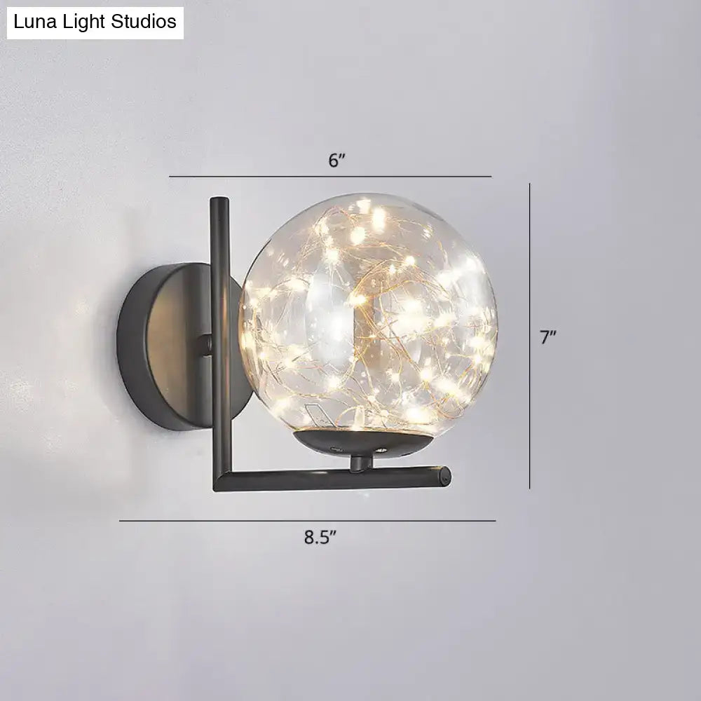 Black Globe Wall Sconce with clear glass orb and string lights, black metal fixture Decorbites on Tampa Home & Garden Store