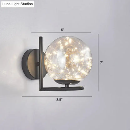 Black Globe Wall Sconce with clear glass orb and string lights, black metal fixture Decorbites on Tampa Home & Garden Store