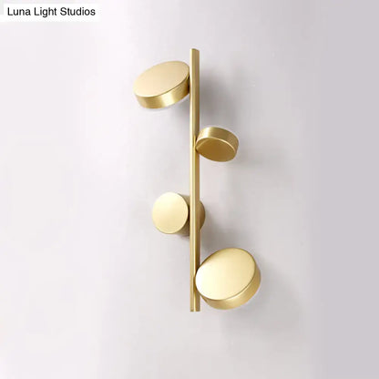 Black Circle Wall Sconce with brass finish and 4 discs on a bar by Decorbites on Tampa Home & Garden Store