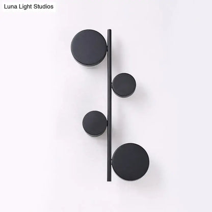 Black Circle Wall Sconce by Decorbites featuring four round discs along a slim vertical bar on Tampa Home & Garden Store