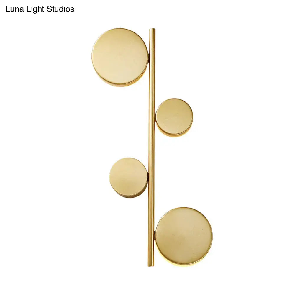 Black Circle Wall Sconce by Decorbites with gold disc accents on brass vertical bar on Tampa Home & Garden Store