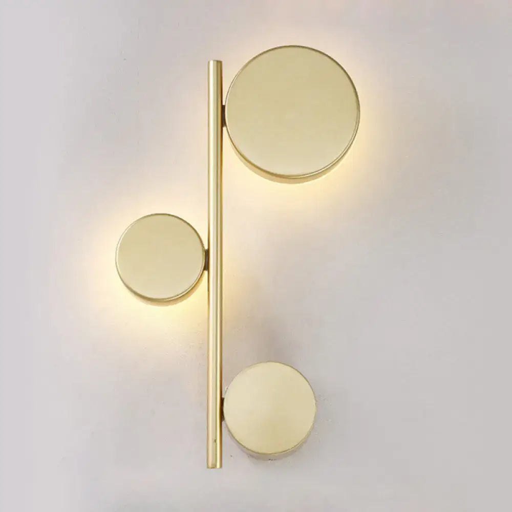 Decorbites Black Circle Wall Sconce featuring a gold bar with three circular discs on Tampa Home & Garden Store