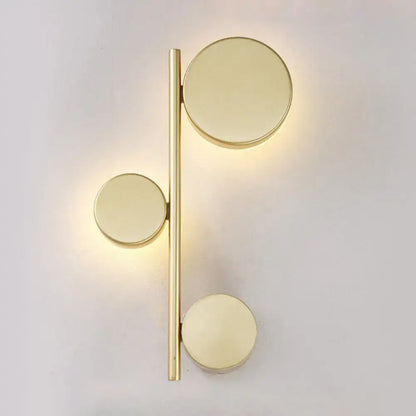 Decorbites Black Circle Wall Sconce featuring a gold bar with three circular discs on Tampa Home & Garden Store