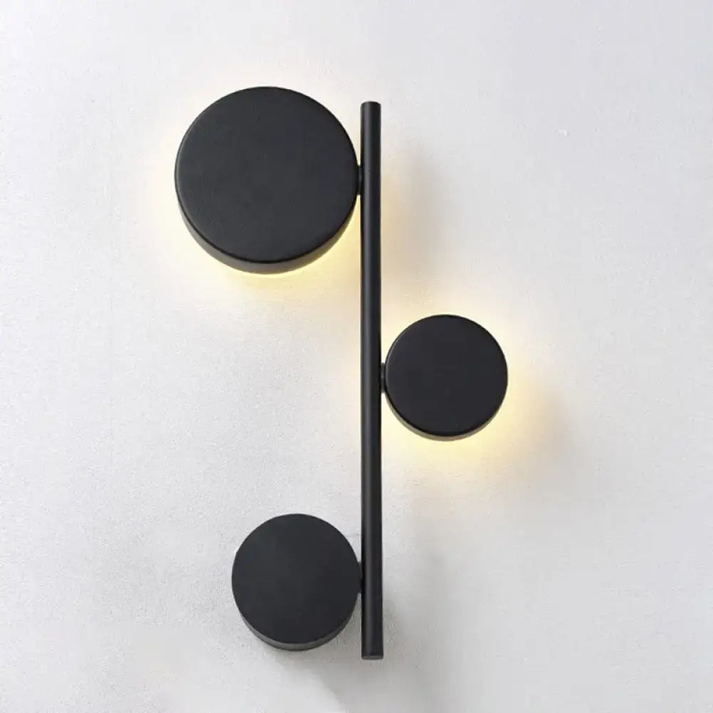 Black Circle Wall Sconce by Decorbites, vertical bar with three discs and warm glow on Tampa Home & Garden Store