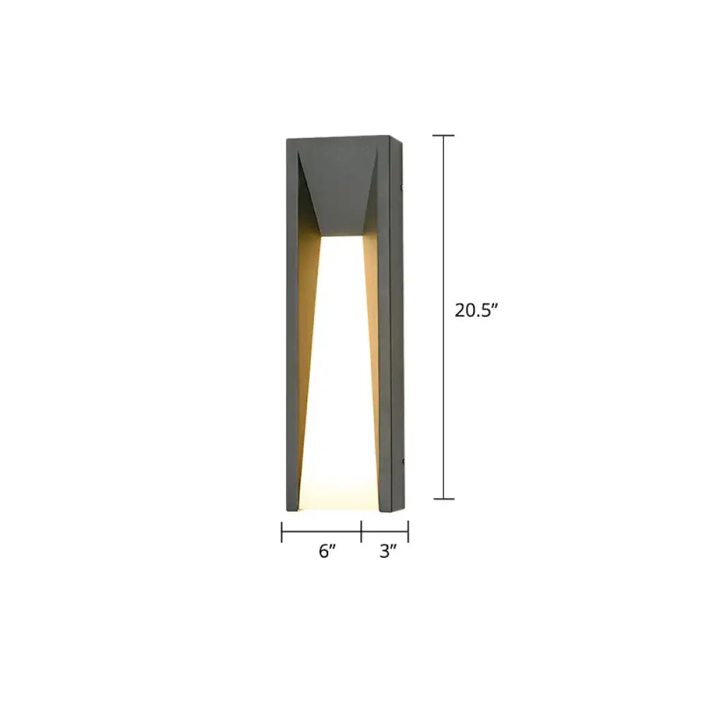 Black industrial 25-inch sconce by Decorbites, matte metal wall light with warm glow on Tampa Home & Garden Store