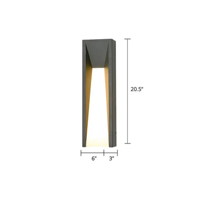 Black industrial 25-inch sconce by Decorbites, matte metal wall light with warm glow on Tampa Home & Garden Store