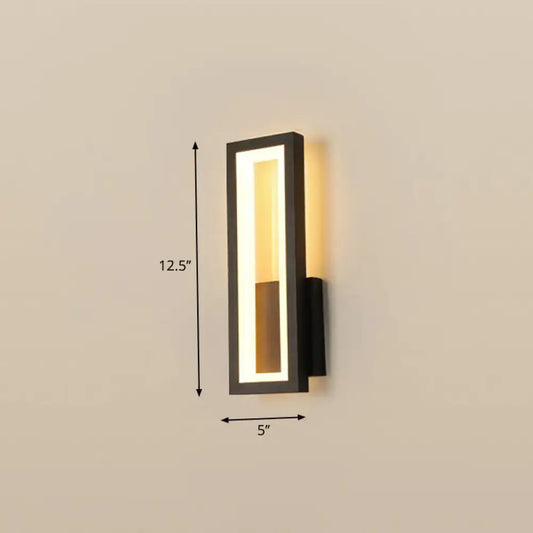 Modern black minimalist LED wall sconce, rectangular foyer light with warm glow on Tampa Home & Garden Store