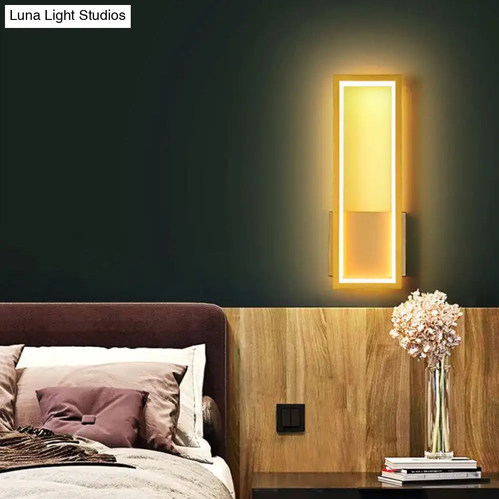 Modern black minimalist LED wall sconce with acrylic panel, warm lighting above headboard on Tampa Home & Garden Store