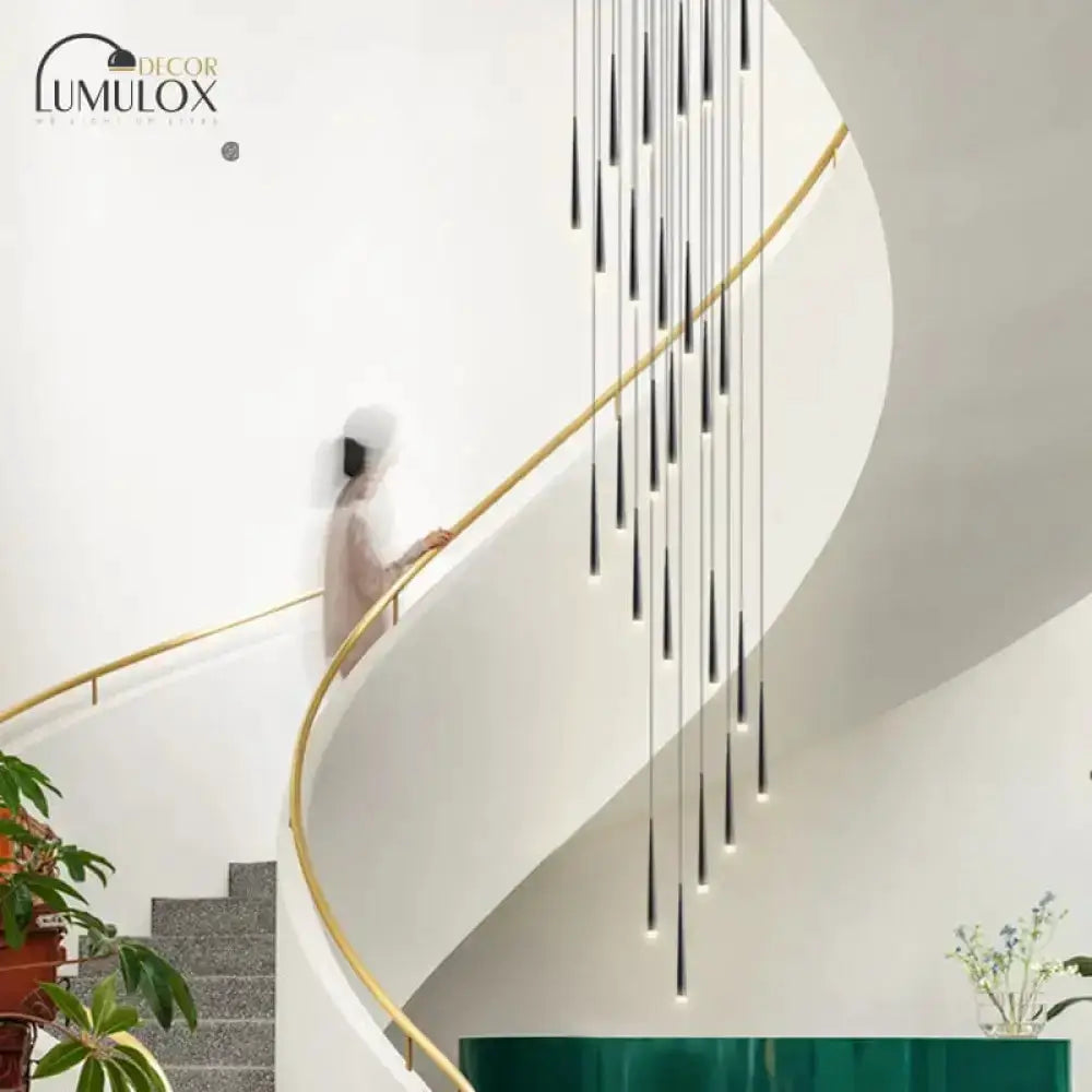 Decorbites black minimalist metallic staircase pendant lights along curved stairwell on Tampa Home & Garden Store