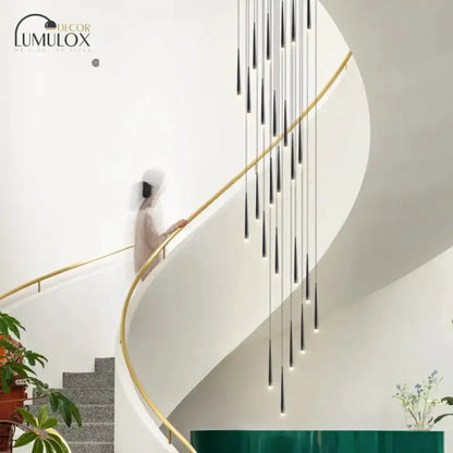 Decorbites black minimalist metallic staircase pendant lights along curved stairwell on Tampa Home & Garden Store
