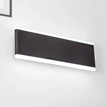 Black industrial 4.5-inch cast iron wall sconce with white end caps by Decorbites on Tampa Home & Garden Store