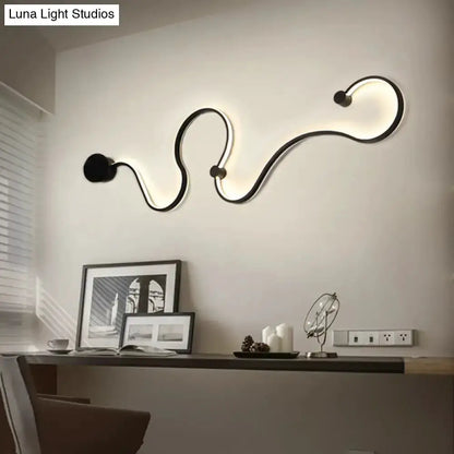 Decorbites modern black minimalist wall lamp with a wavy LED sconce for living room decor on Tampa Home & Garden Store