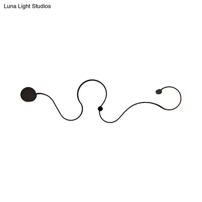 Modern black minimalist wall lamp sconce with curved arm and round light heads Decorbites on Tampa Home & Garden Store