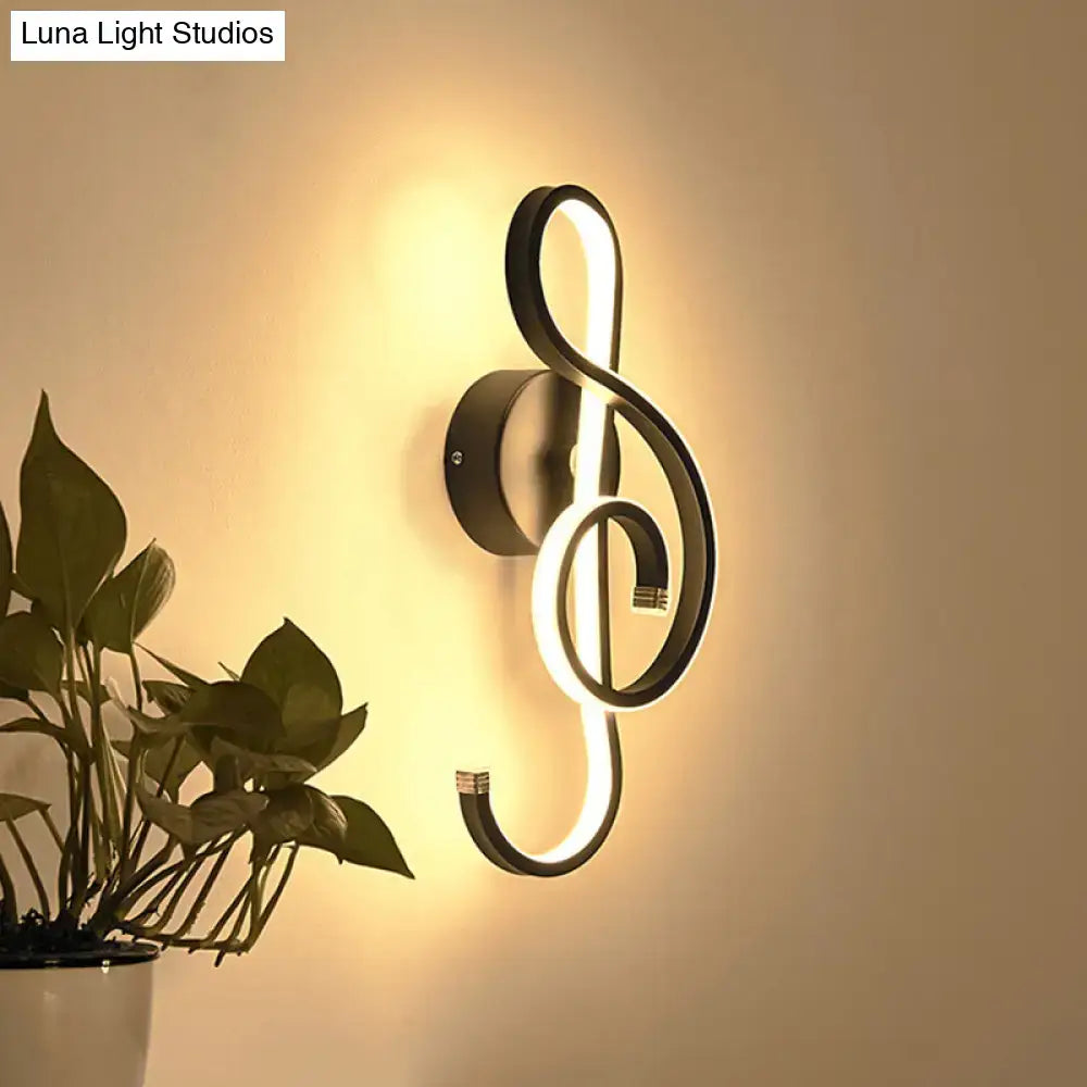 Black Music Note Sconce, black metal wall light with warm LED glow, Decorbites on Tampa Home & Garden Store