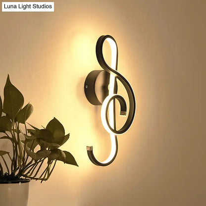 Black Music Note Sconce, black metal wall light with warm LED glow, Decorbites on Tampa Home & Garden Store