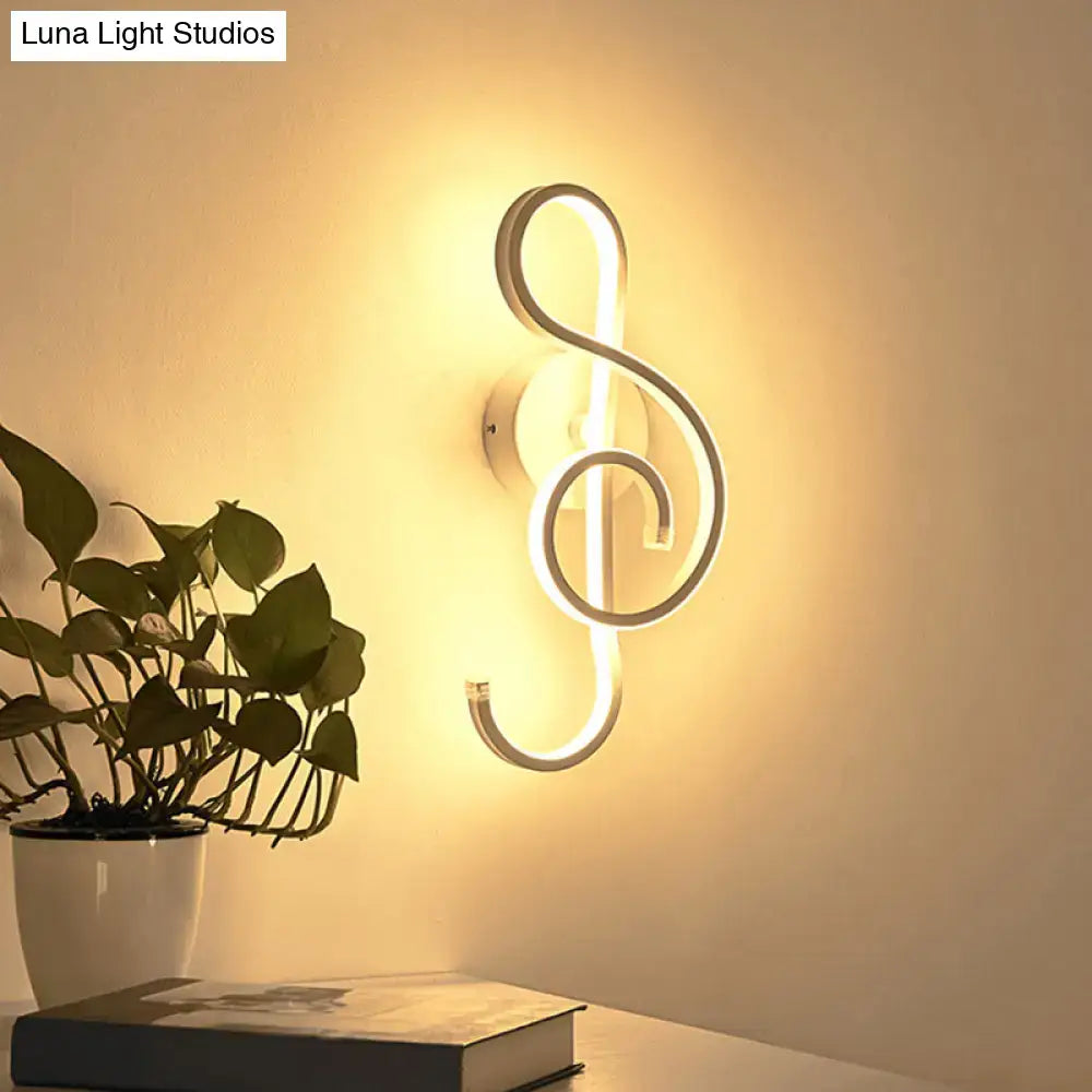 Black music note sconce neon wall light by Decorbites with warm white glow on Tampa Home & Garden Store