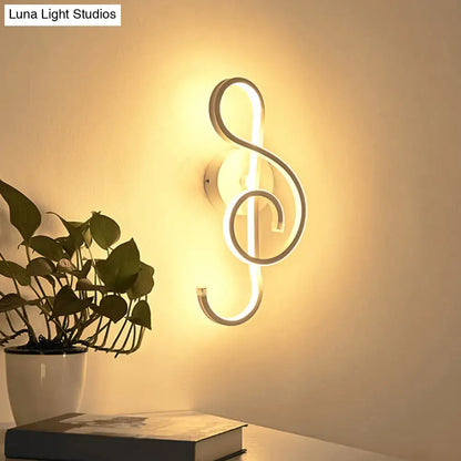 Black music note sconce neon wall light by Decorbites with warm white glow on Tampa Home & Garden Store