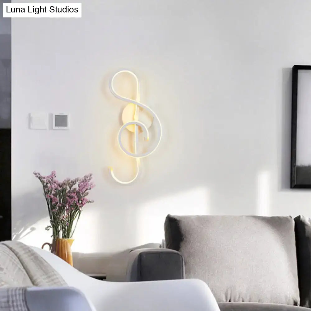 Black Music Note Wall Sconce by Decorbites, warm LED glow, modern metal design on Tampa Home & Garden Store