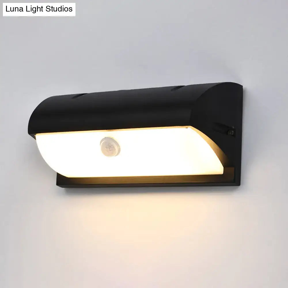 Black outdoor LED sconce by Decorbites, wall-mount light with curved housing on Tampa Home & Garden Store