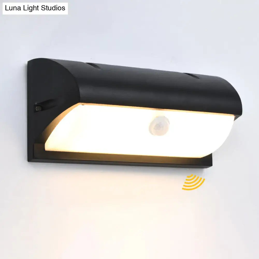 Black Decorbites outdoor LED wall sconce with curved housing and frosted glass shade on Tampa Home & Garden Store