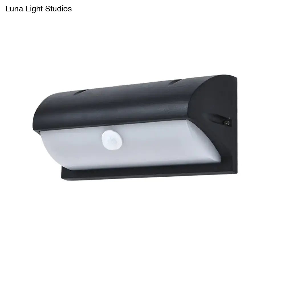 Black outdoor LED sconce by Decorbites with wall-mount, white curved diffuser on Tampa Home & Garden Store