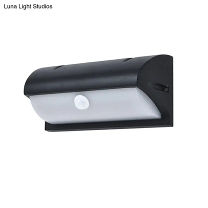 Black outdoor LED sconce by Decorbites with wall-mount, white curved diffuser on Tampa Home & Garden Store