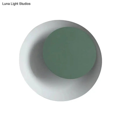 Modern circle sconce light with white backplate and green accent circle, bedroom wall fixture on Tampa Home & Garden Store