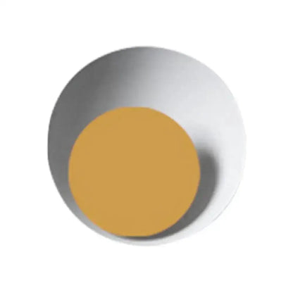 Circle sconce light with silver base and mustard yellow center on Tampa Home & Garden Store
