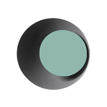 Modern circle wall sconce by Decorbites with black outer disk and teal center on Tampa Home & Garden Store