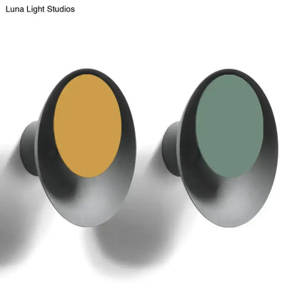 Decorbites modern black circle sconce wall light pair with amber and teal centers on Tampa Home & Garden Store