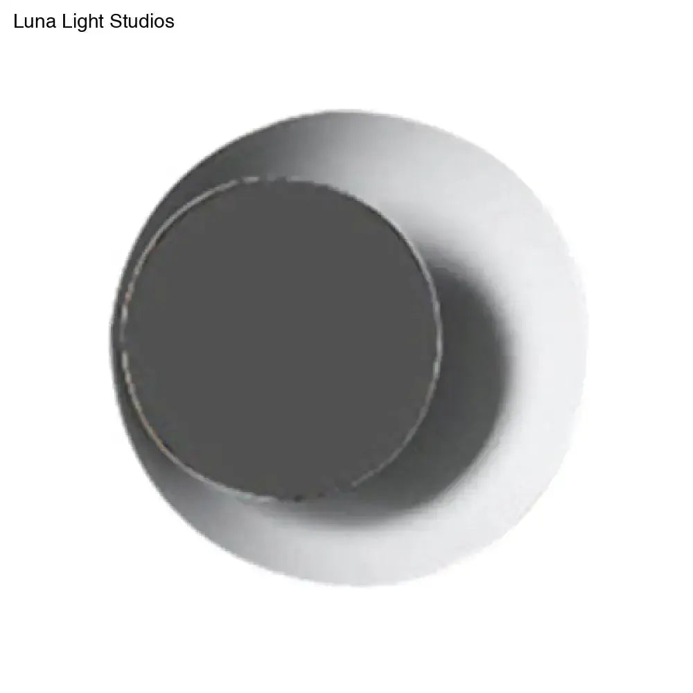 Modern circle sconce light with metallic two-tone finish, dark center and lighter outer ring on Tampa Home & Garden Store