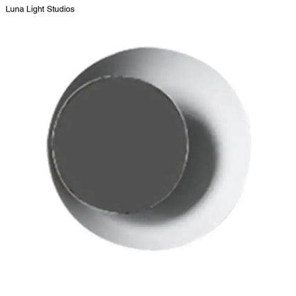 Modern circle sconce light with metallic two-tone finish, dark center and lighter outer ring on Tampa Home & Garden Store