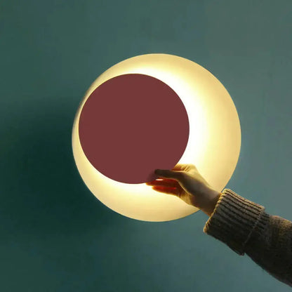Decorbites modern black pink circle sconce wall light for bedroom with pink center glow on Tampa Home & Garden Store