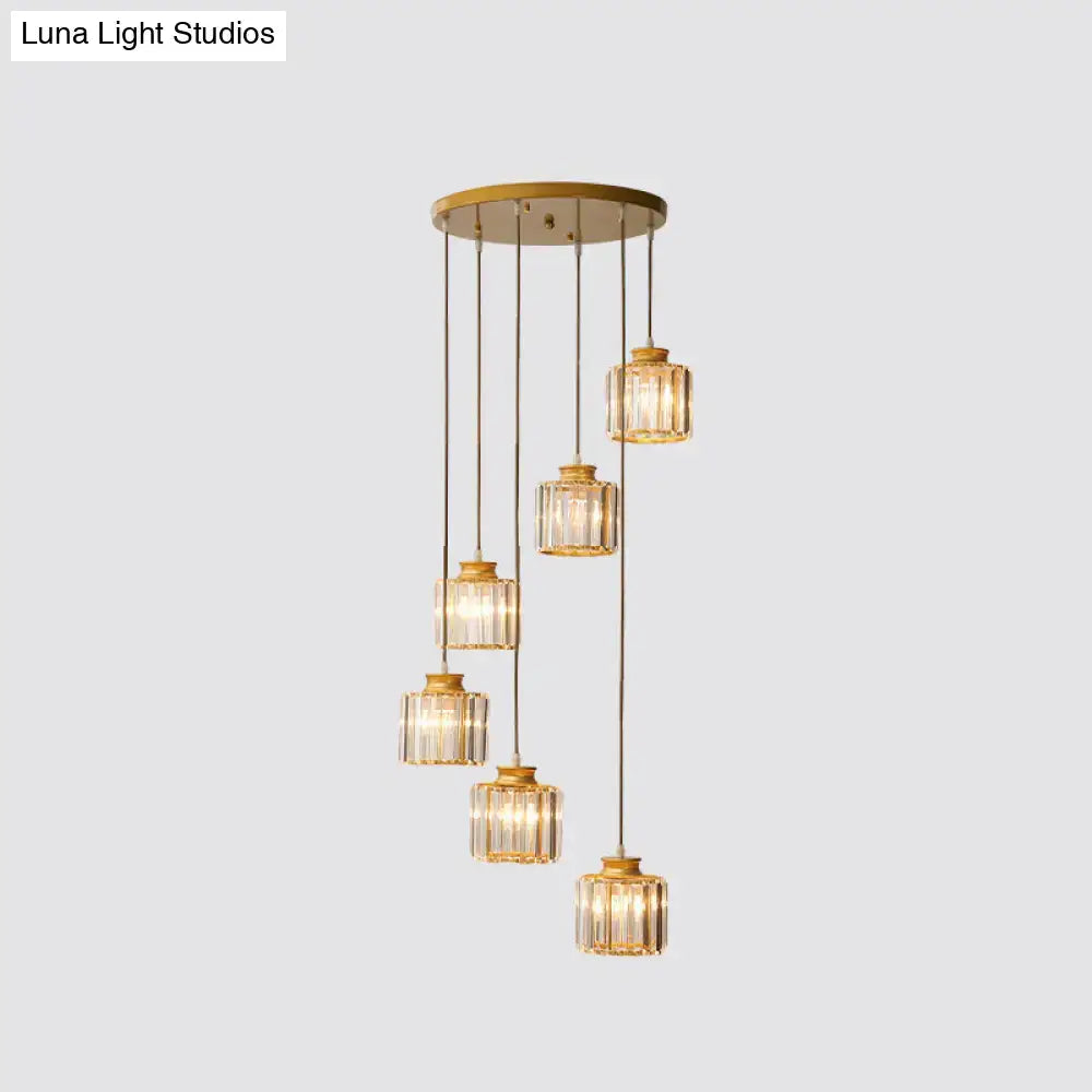 Gold-tone crystal cylindrical stairway pendant lights with six hanging fixtures on Tampa Home & Garden Store