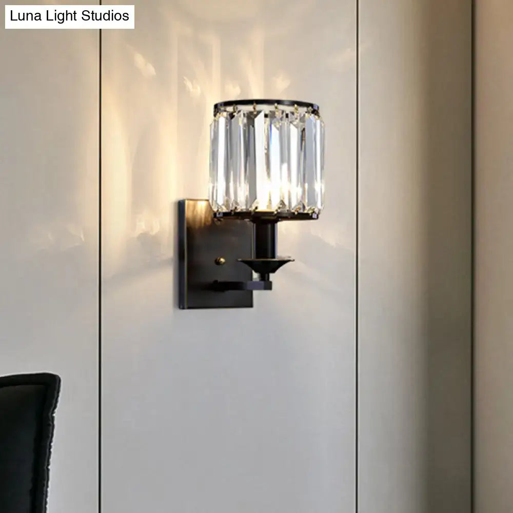 Black crystal cylindrical wall sconce by Decorbites with clear prisms and black metal mount on Tampa Home & Garden Store