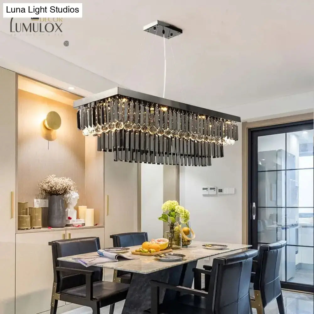 Black crystal rectangle chandelier by Decorbites over a marble dining table in a modern kitchen on Tampa Home & Garden Store