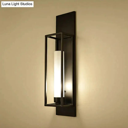 Modern black rectangular wall lamp with frosted glass cylinder shade in a metal frame on Tampa Home & Garden Store