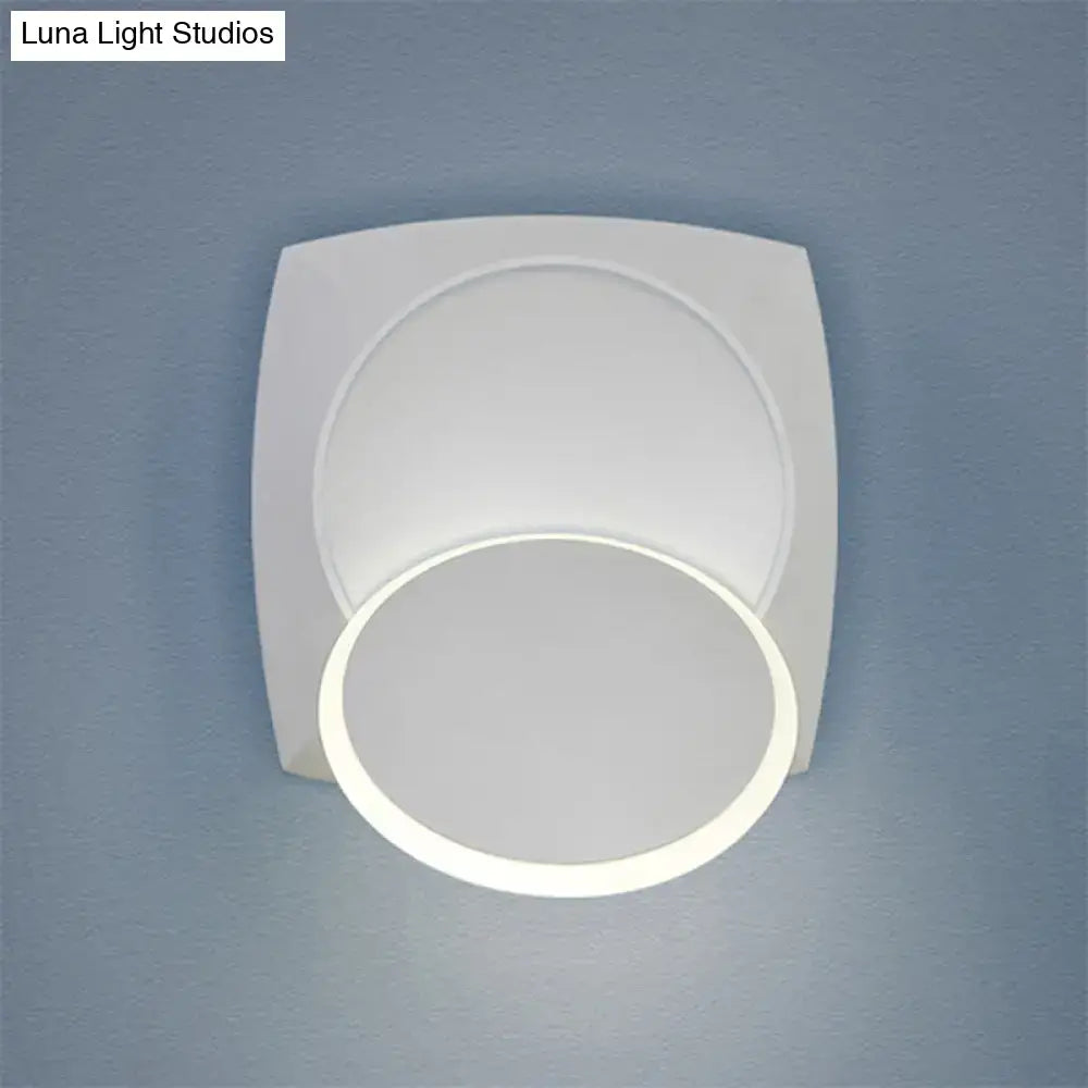 White circular LED wall sconce with overlapping rings on Tampa Home & Garden Store