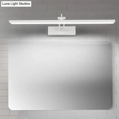 Black Rotatable Vanity Sconce by Decorbites with long light bar above a mirror on Tampa Home & Garden Store